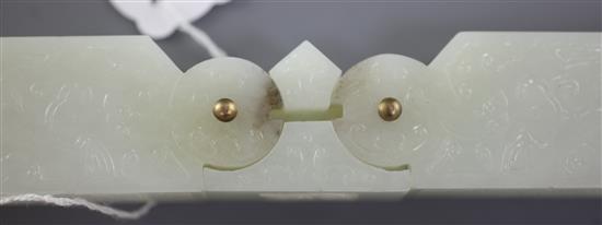 A Chinese archaistic pale celadon jade vessel or instrument, 9.5cm
